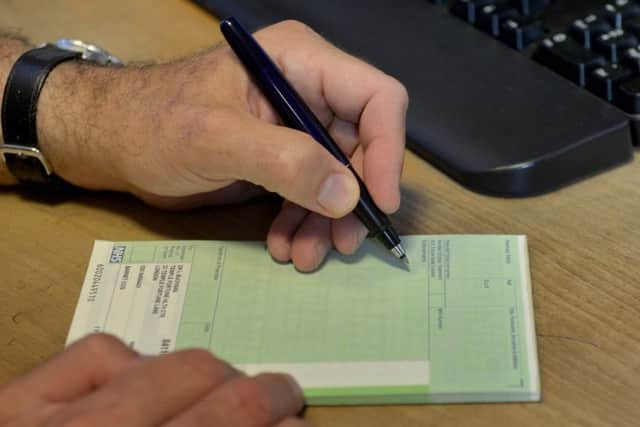 A GP writing out a prescription. Credit Anthony Devlin/PA Wire