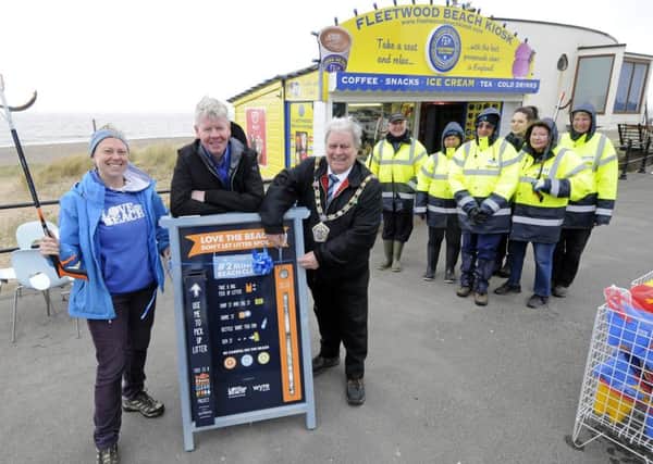 LOVEmyBEACH launch their '2 Minute Beach Clean' scheme at Fleetwood Beach Kiosk.  Pictured is Emma Whitlock from LOVEmyBEACH with Craig McOmish and Wyre mayor Terry Lees with volunteers from the Wyre Countryside Service.