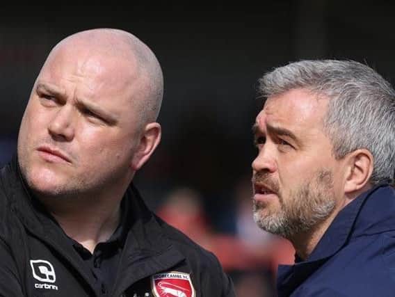 Cheltenham assistant manager Russell Milton, right, with Morecambe boss Jim Bentley