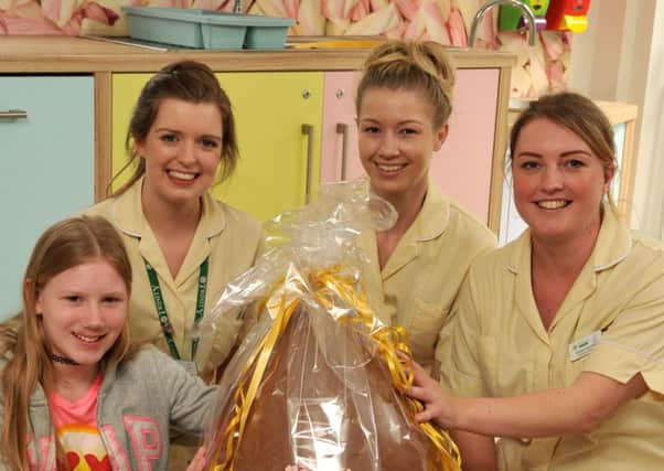 Photo Neil Cross
Ella Singleton, 11, won a giant Easter egg from Mr Simms and donated it to all the staff at Brian House.
Ella with Mina Scott from Houndshill, Gemma Nutall from Mr Simms and Health Care Assistants Shauna Wilson and Rachel Hennessey