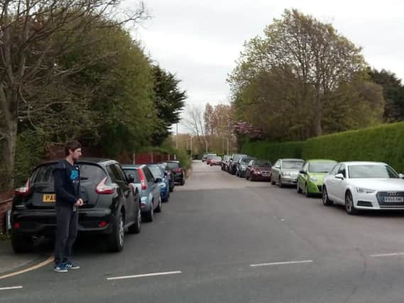 People who live near St Nicholas's School are complaining about traffic chaos when parents come to pick up their children.
Cars parked down Sandy Lane.