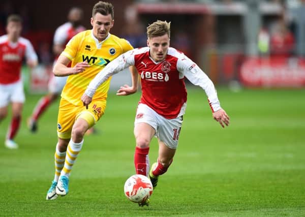 Fleetwood Town's George Glendon surges away from Millwall's Jed Wallace