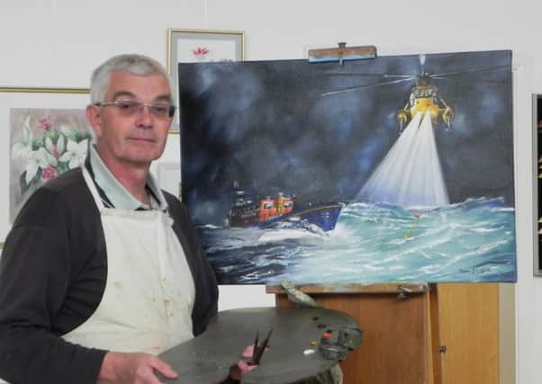 Trevor Loftus of Lytham St Annes Art Society with his artwork being sold for the Lytham St Annes RNLI Shannon Appeal