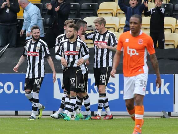 The Notts County players celebrate their goal