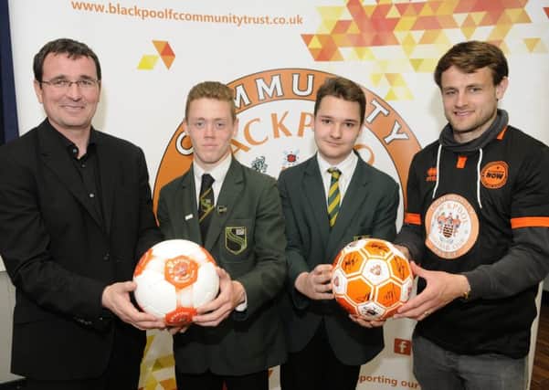 Blackpool's Gary Bowyer and  Andy Taylor with South Shore pupils Kye Wylie and Liam Barlow