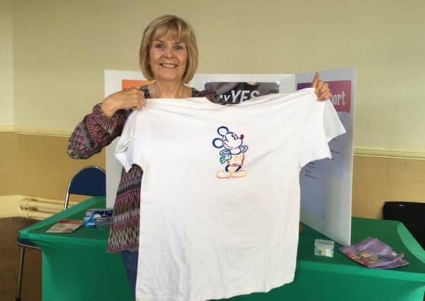 Enid Miller with her old T-shirt she used to wear when she was a size 22
Weight Watchers weight loss story for Eve