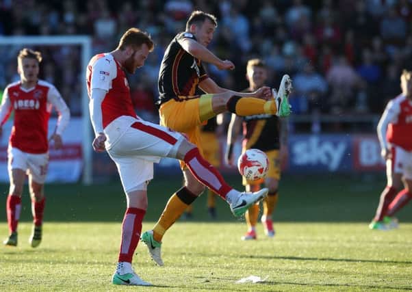 Bradford's Charlie Wyke (right) and Fleetwood Town's Cian Bolger battle for the ball during the Sky Bet League One playoff semi-final, second leg match at Highbury Stadium, Fleetwood. PRESS ASSOCIATION Photo. Picture date: Sunday May 7, 2017. See PA story: SOCCER Fleetwood. Photo credit should read: Martin Rickett/PA Wire. RESTRICTIONS: EDITORIAL USE ONLY No use with unauthorised audio, video, data, fixture lists, club/league logos or "live" services. Online in-match use limited to 75 images, no video emulation. No use in betting, games or single club/league/player publications.