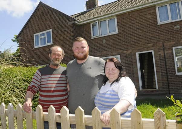 The Crossfield family have moved in to their new home after they losing their old one to a fire. Pictured L-R are David Crossfield, Daniel Crossfield and Glynis Crossfield.