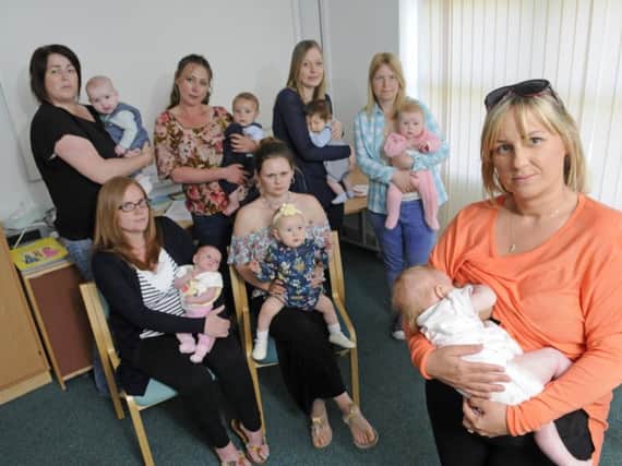 Mums from the St Cutherbert's Breastfeeding Group are angry that Blackpool Council have cut funding for breastfeeding support workers from the Star Buddies scheme.  Pictured front is Sam Davies holding Elliott-Rae Langford.