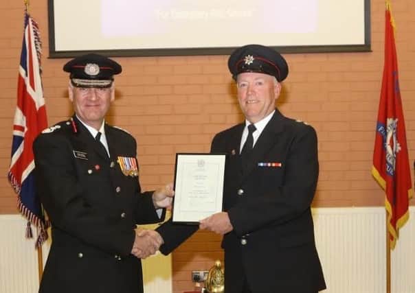 Chief fire officer for Lancashire Chris Kenny (left), with retiring watch manager Dave Laver