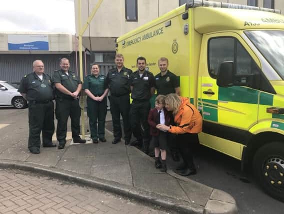 Theo Heyworth-Hill, four, meets paramedics at Blackpool Ambulance Station (Pic: North West Ambulance Service)