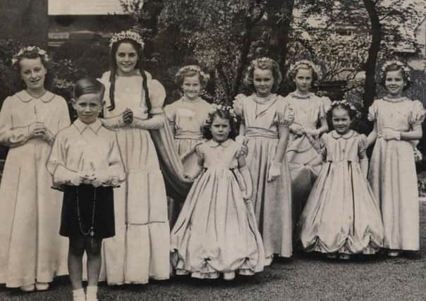 The May Queen, Jean Salisbury, who crowned the statue of Our Lady in St Peter's RC Church, Lytham, with her retinue, in May 1954.
The cushion bearer is John Bailey