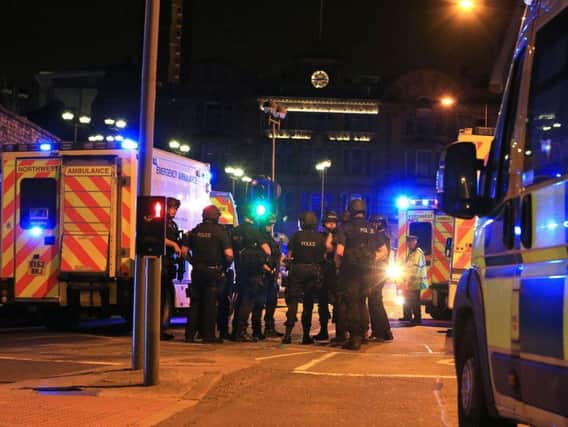 Armed police at Manchester Arena after reports of an explosion at the venue during an Ariana Grande gig (Pic: Press Association)