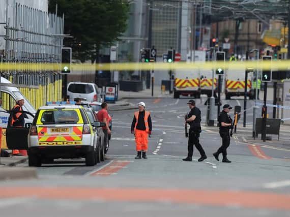 A police cordon is in place around Manchester Arena