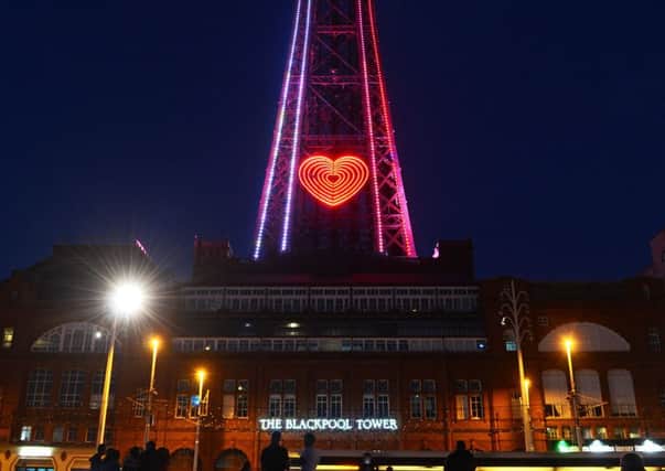 The Blackpool Tower is illuminated in red, white and blue followed by an illuminated heart as a mark of respect and support to those affected in Manchester