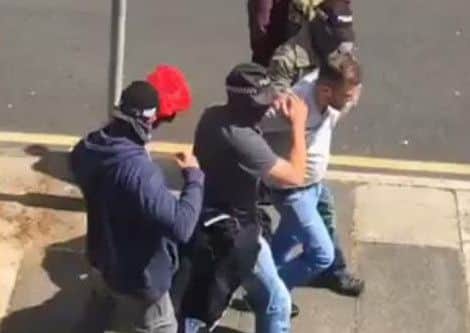 Police swoop on a man near to Wigan town centre. Video courtesy of Shann Corbett