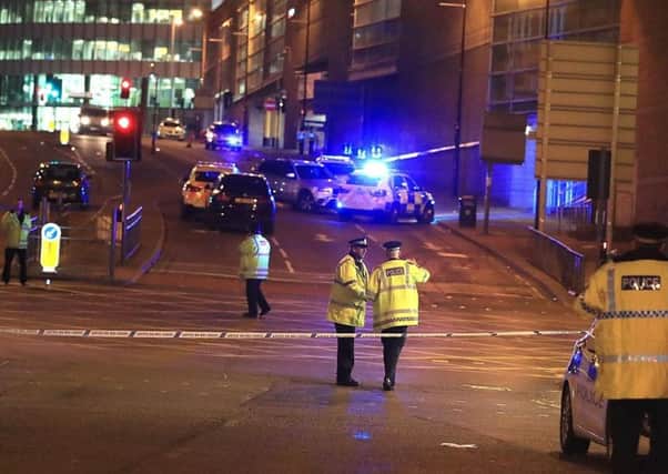 Emergency services at Manchester Arena after reports of an explosion at the venue during an Ariana Grande gig