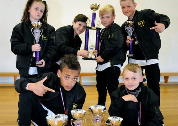 Two teams from the Urban Dance Project based at Unity Academy in Blackpool scooped 1st and 3rd at the recent BDO Championships held at the Tower.
Urban Dodgers with their trophies.  PIC BY ROB LOCK
22-5-2017