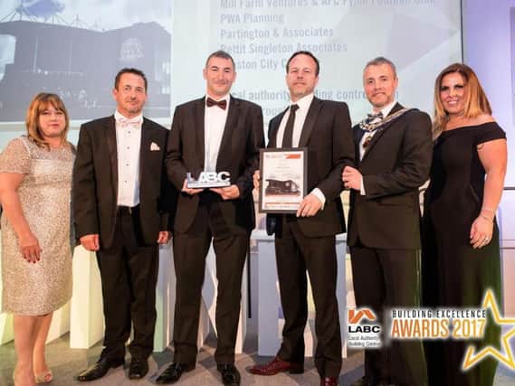 The team from Kirkham-based Warden Construction win a top constriction award win for work on the  AFC Fylde stadium