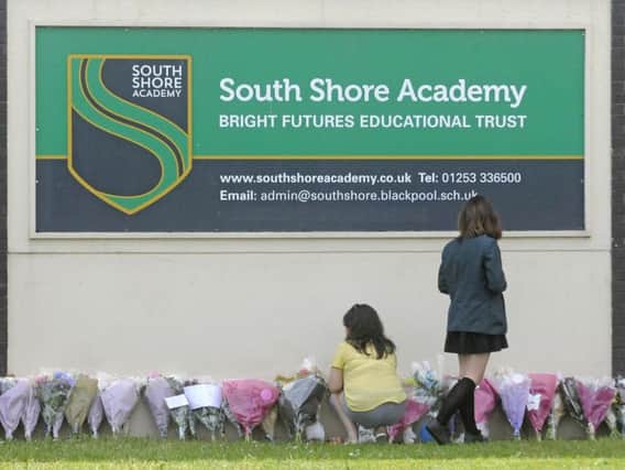 Floral tributes outside South Shore Academy