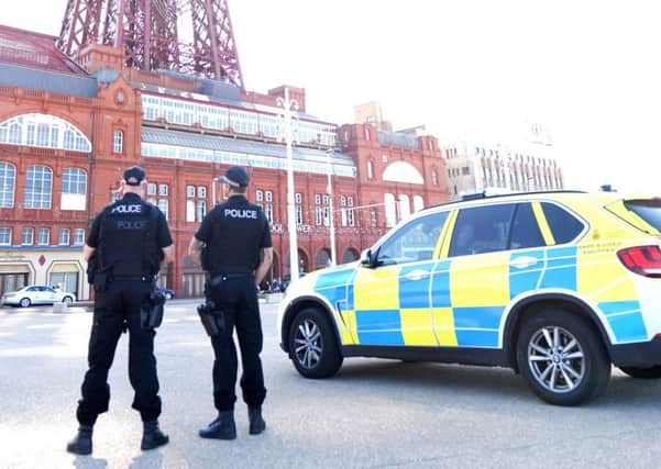 Armed  police on the Promenade in Blackpool yesterday