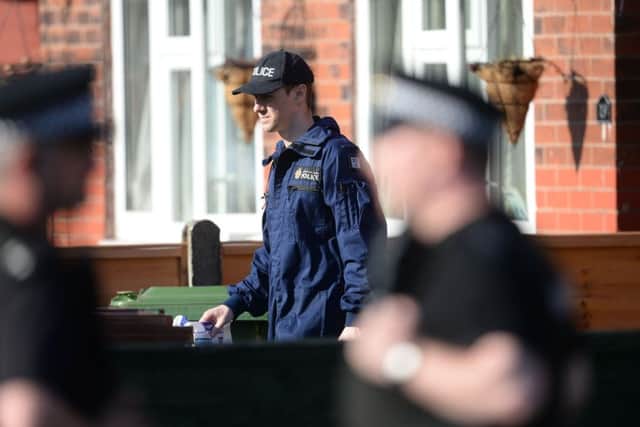 Police search an address in Greater Manchester last week