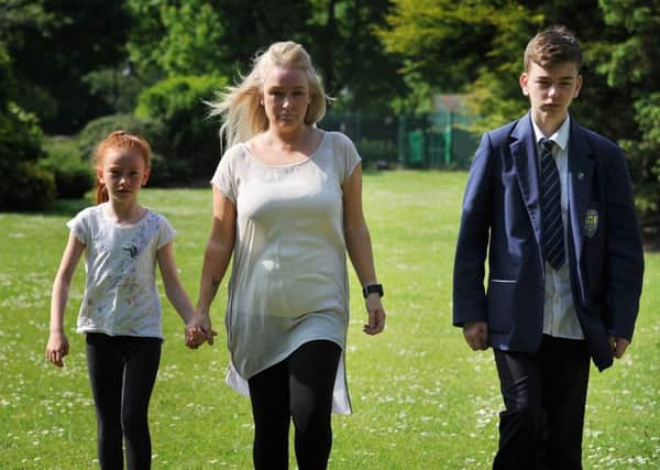 Lynette Worthington, of Hayfield Avenue in Poulton, is calling for more patrols in Vicarage Park following an assault on her son Lucas while he was playing there with his sister.
Lynette in the park with Lucas and Sophia.  PIC BY ROB LOCK
25-5-2017