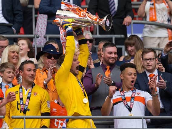 Slocombe lifts the League Two play-off final trophy