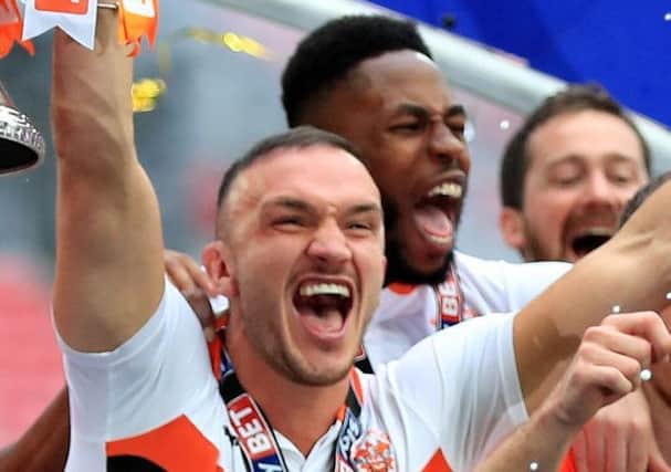 Tom Aldred has a decision to make after being offered a new deal with Blackpool amid interest from elsewhere