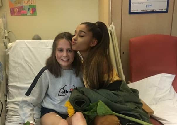 Family handout photo of Ariana Grande meeting Evie Mills as the American singer visited young fans at the Royal Manchester Children's Hospital ward who were  injured in the Manchester terror attack. Photo credit: Karen Mills/PA Wire