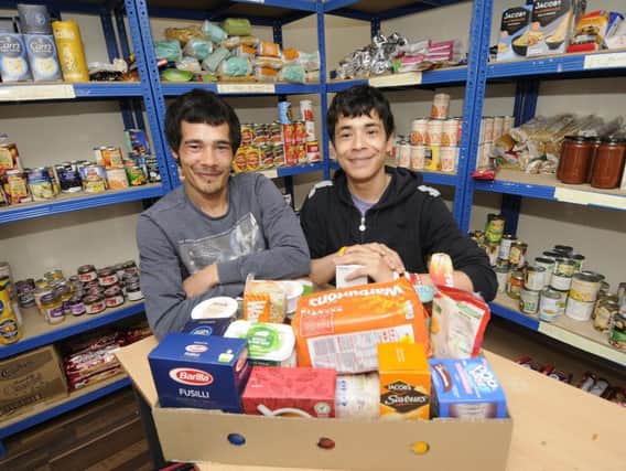 Volunteers and service users Jonathon Taitt and Franklin Taitt from His Provision CIC food bank on Central Drive