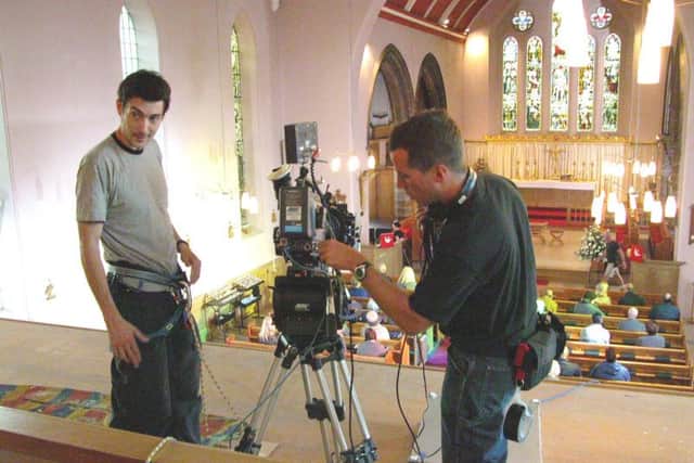 Film crews on location at St Peter's Church in Fleetwood during the making of the psychological thriller Frozen.