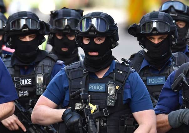 Armed police on St Thomas Street, London, near the scene of last night's terrorist incident at Borough Market.