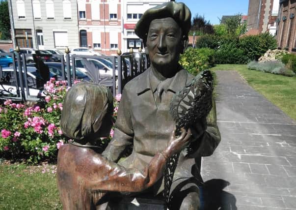 A statue in Caudry portraying the French town's links with the lace industry