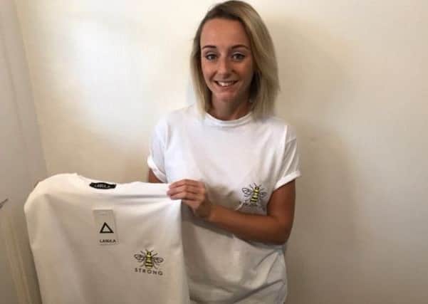 Gaby Little with the t-shirt she designed in aid of  the Manchester emergency fund