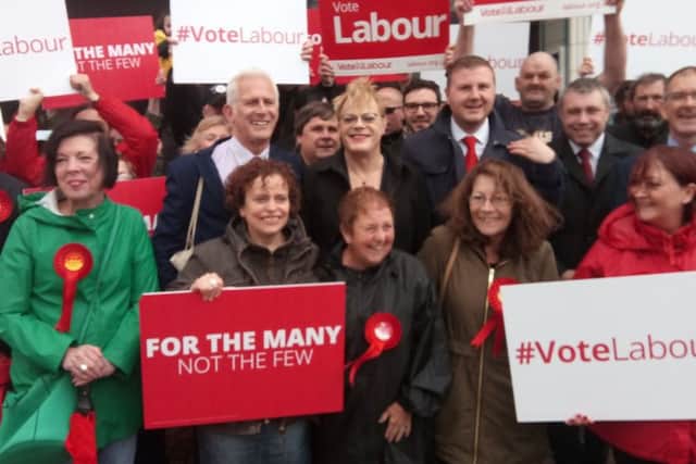 Gordon Marsden, Eddie Izzard and Chris Webb with Labour supporters outside the Winter Gardens