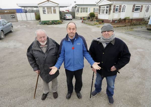 Residents at Windmill Caravan Park fear they could lose their homes following a planning application for a drive-thru by the nearby petrol station.  Pictured L-R are Ralph Carte, Steven Roy Gratrix and Terry Duran from the Windmill Park Residents Association.