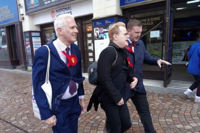 TV star Eddie Izzard with Labour's Gordon Marsden, left, and Chris Webb, right