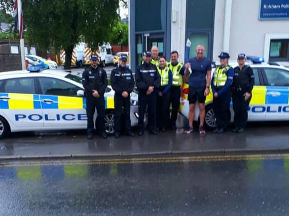Relay runners in the rain at Kirkham