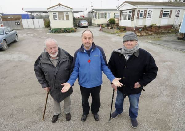 Residents at Windmill Caravan Park feared they could lose their homes following a planning application for a drive-thru by the nearby petrol station.  Pictured L-R are Ralph Carte, Steven Roy Gratrix and Terry Duran from the Windmill Park Residents Association.