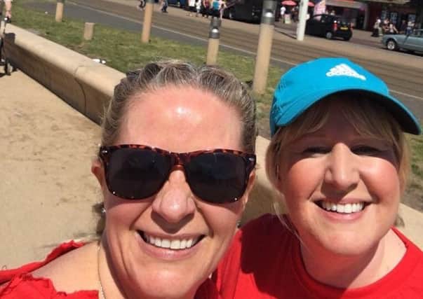 Sarah Lonergan and Lisa Allison, from Santander Cleveleys, running their half marathon through the Fylde coast in aid of Fylde Coast Women's Aid