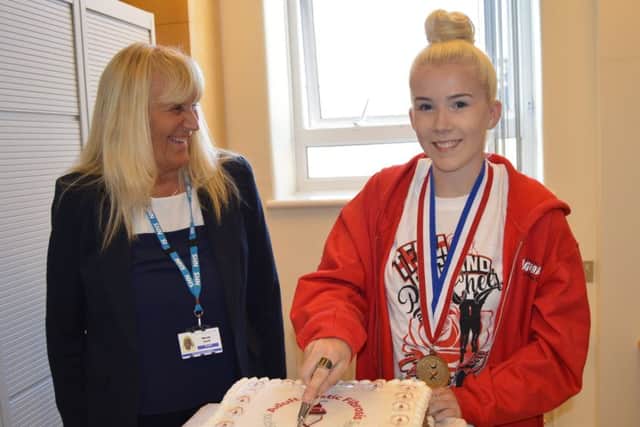 Emily Bonney cuts the cake with Wendy Swift, chief executive of Blackpool Teaching Hospitals NHS Foundation Trust