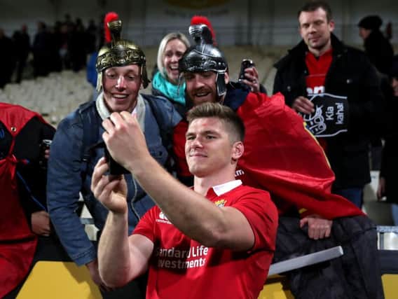 Owen Farrell celebrates with fans after the match