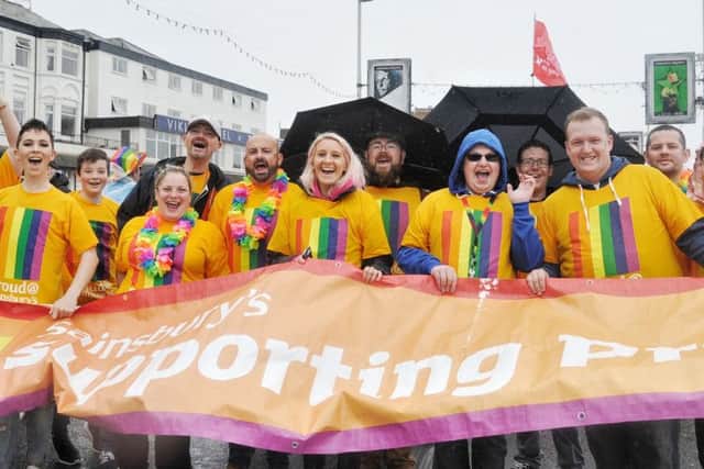 Blackpool Pride parade braving heavy rain. Picture by Julian Brown