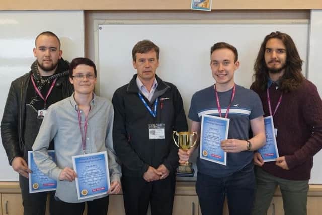 The winning students get their awards.  (L-R): Zanda Gould, Ethan Demar, Richard Wood (tournament organiser) Robert Lambert and Antonio Marmo.