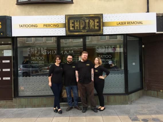 Empire Tattoo and Piercing has opened on Church Street near FY Creatives. Left to right, Sarah and Sean Powell, Connor  and Catherine Prue