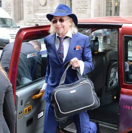 Owen Oyston arriving at court in a taxi