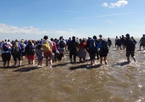 Paddling through channels of the River Kent on the Morecambe Bay Walk