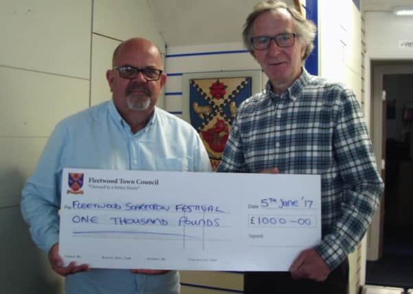Terry Rogers (left), chairman of Fleetwood Town Council,  presents Shaun McNeill with a cheque for Â£1,000 towards Fleetwood's Scarecrow Festival.