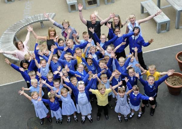 Staff and pupils from Christ The King School celebrate after being rated 'good' by Ofsted
